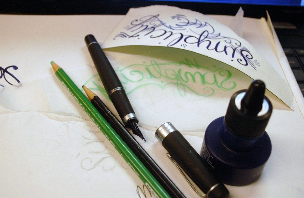 This is a stepbystep for script cursive lettering in a slanted style in 