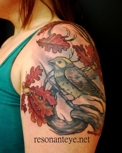 bird with autumn leaves tattoo